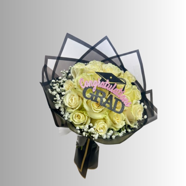 Yellow rose bouquet with a graduation topper and black wrap