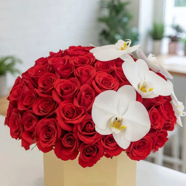 Red rose arrangement with white orchids in a beige box