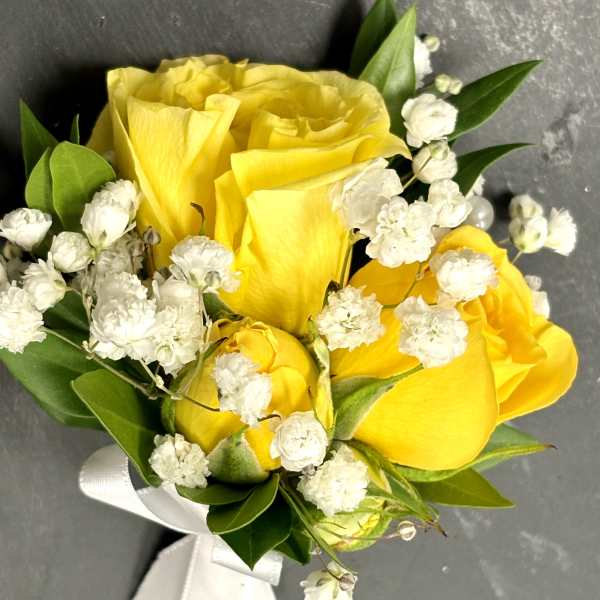 Yellow rose bouquet with white baby's breath and ribbon