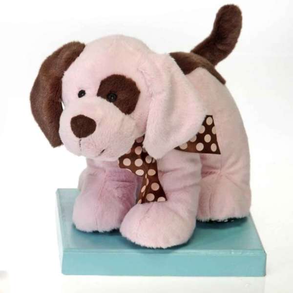 Plush puppy figurine with a polka-dot bow on a blue box