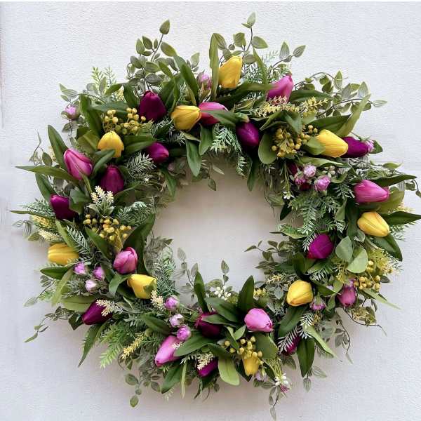 Circular wreath with pink and yellow tulips and mixed greenery