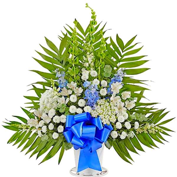 White and blue floral standing spray with a blue ribbon