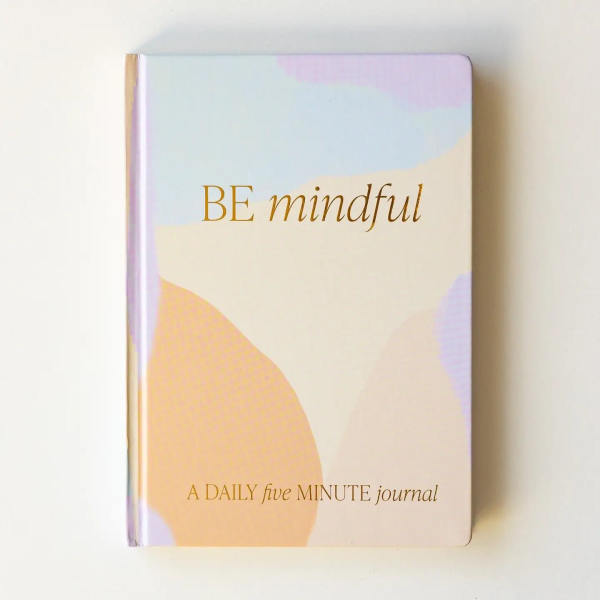 Pastel journal with the words "BE mindful" on the cover