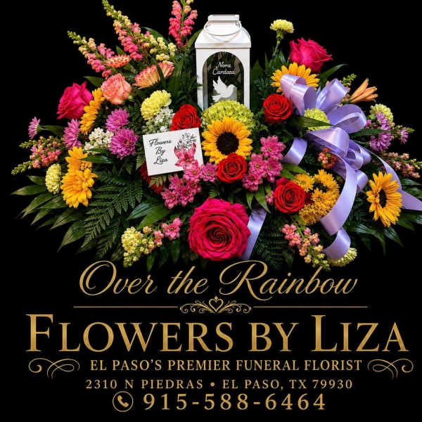 Colorful funeral floral spray with roses, sunflowers, and ribbon on a black background