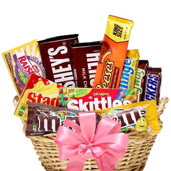 Basket of assorted candy bars and sweets tied with a pink ribbon