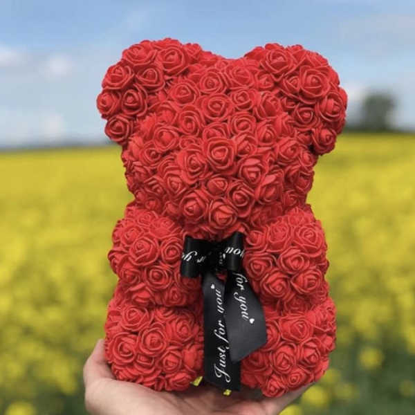 Red rose teddy bear with a black ribbon