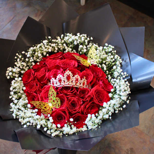 Red rose bouquet with white baby's breath and decorative butterflies