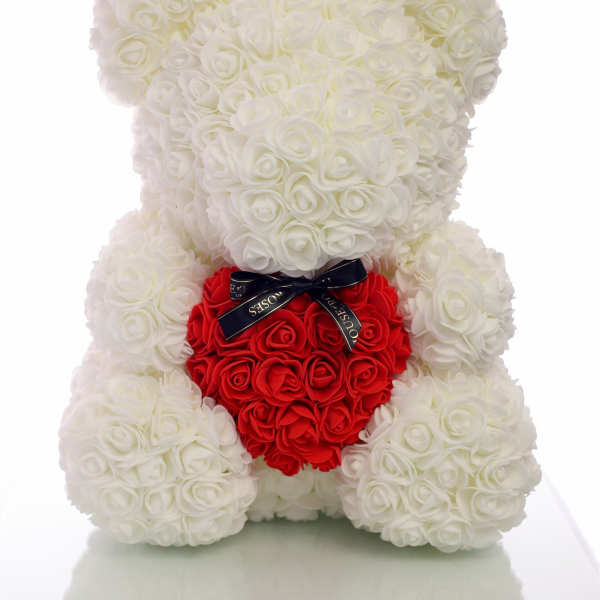 White rose teddy bear holding a red rose heart