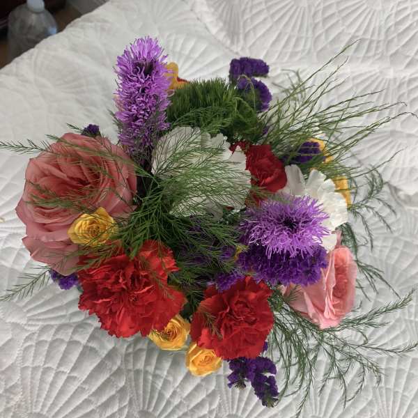 Mixed bouquet with pink, red, purple, and yellow flowers