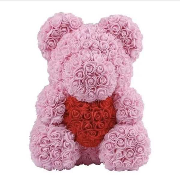 Pink rose teddy bear holding a red heart