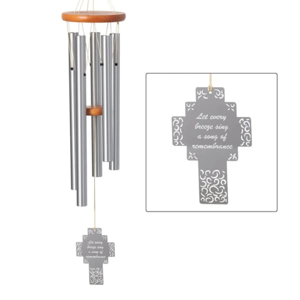 Silver wind chime with a cross-shaped remembrance tag