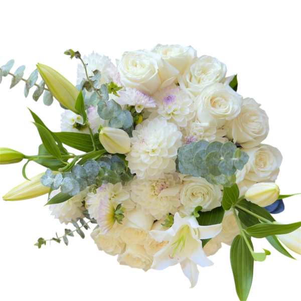 White rose and lily bouquet with pale blooms and eucalyptus