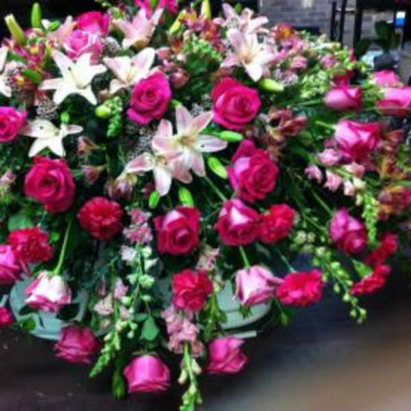 Large arrangement of pink roses and white lilies