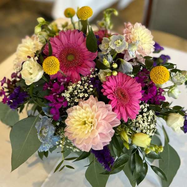 Mixed bouquet with pink gerbera daisies and pastel blooms
