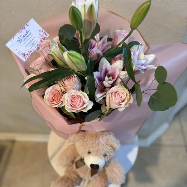 Pink rose and lily bouquet with a teddy bear attached