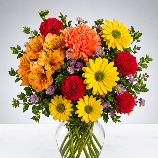 Colorful mixed bouquet in a clear glass vase