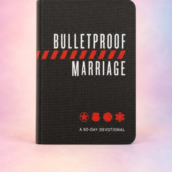 Black devotional book titled "Bulletproof Marriage" on a pastel background.