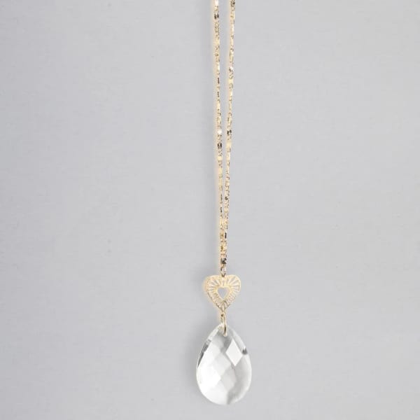 Gold chain necklace with a small heart charm and a clear teardrop crystal pendant