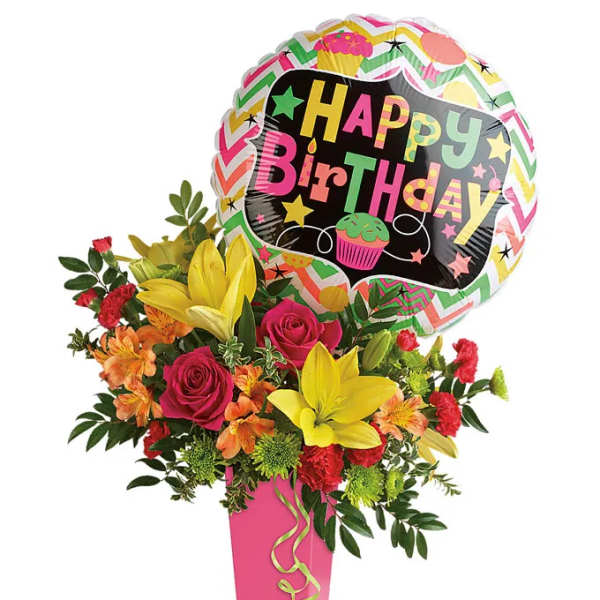 Birthday bouquet with roses, lilies, and a balloon in a pink vase