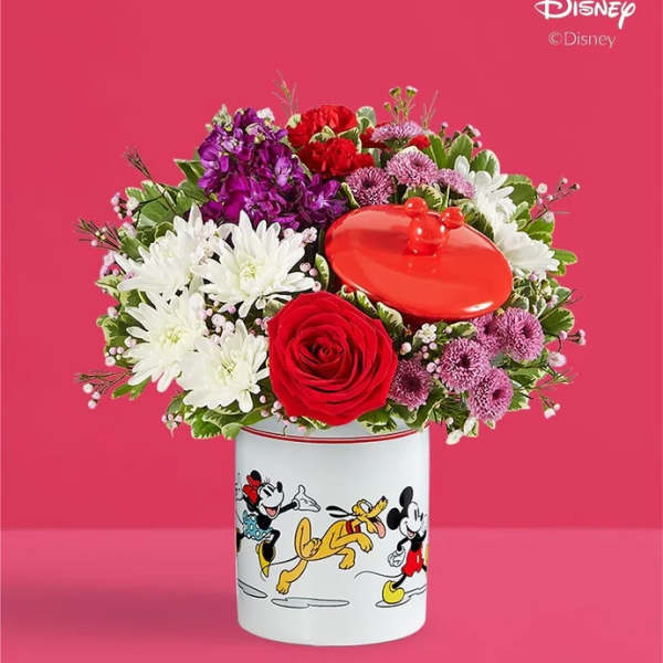 Bouquet of red, white, and purple flowers in a Disney Mickey and Friends container