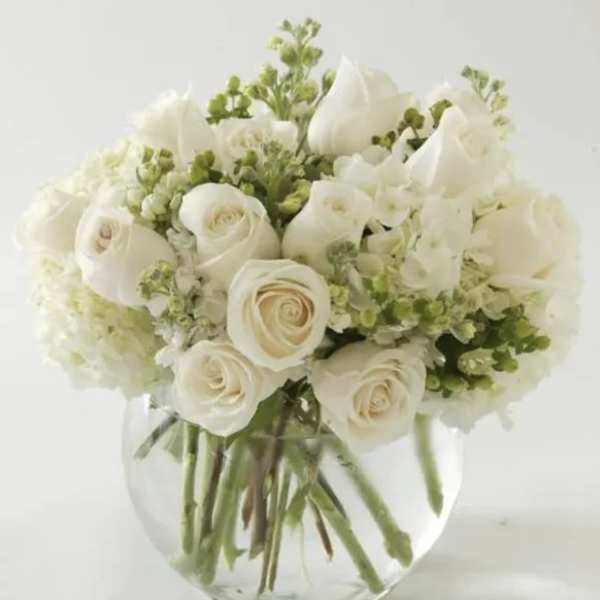 White rose bouquet in a clear glass vase