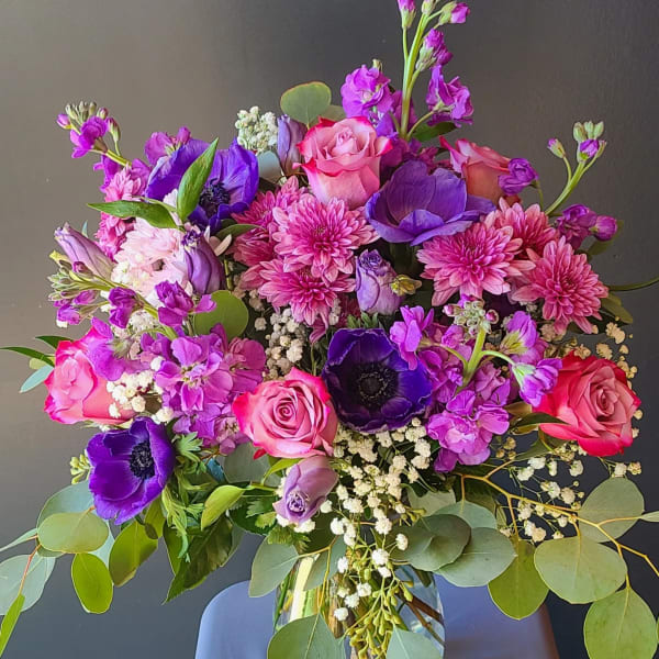 Bouquet of pink and purple flowers in a glass vase