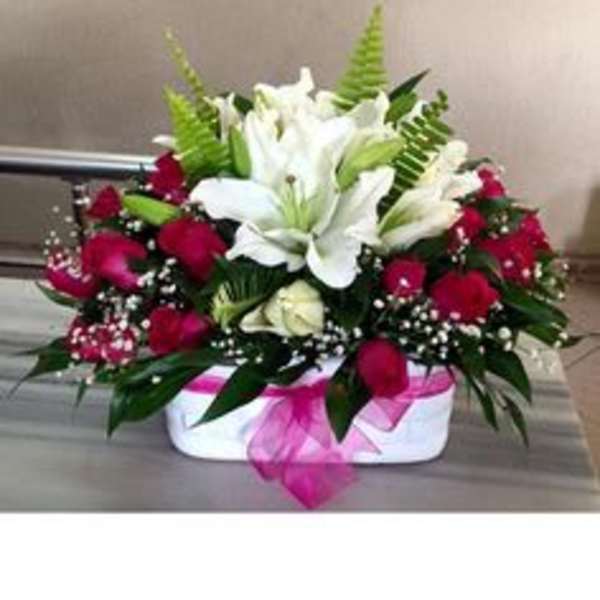 Red rose and white lily arrangement