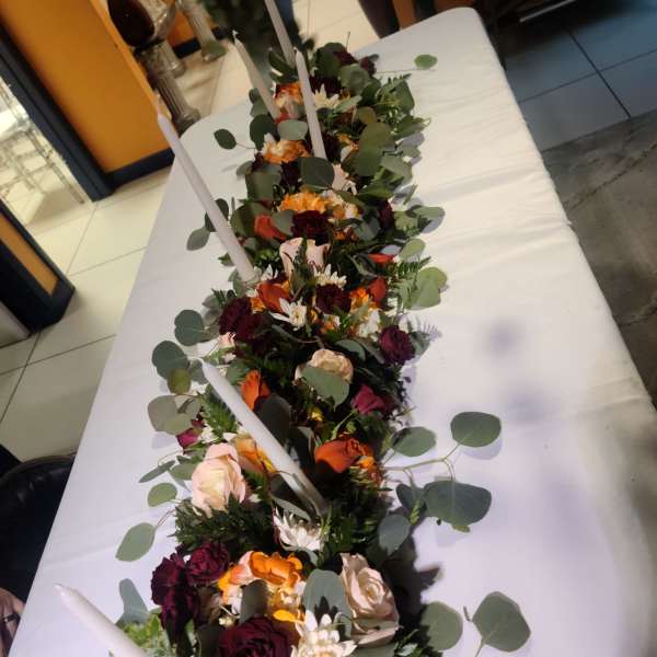 Elegant long table center piece for special events sold by foot $55.00