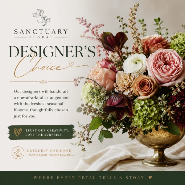 Mixed floral arrangement in a gold vase with pink, white, and green blooms