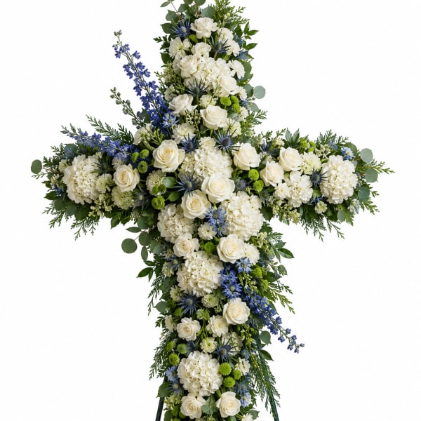 Cross-shaped floral standing spray with white roses and blue accents