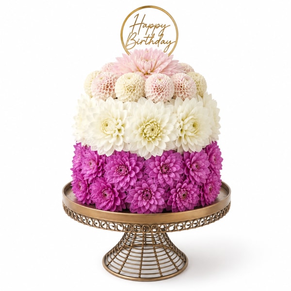Tiered pink, white, and purple flower arrangement with a Happy Birthday topper