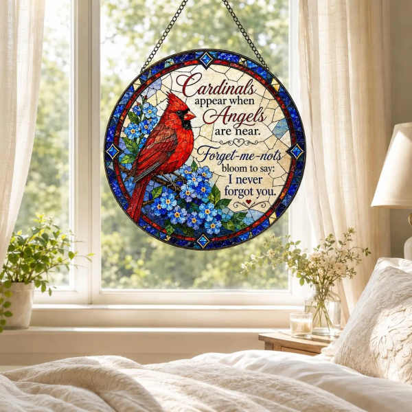 Round stained-glass panel with a red cardinal and blue flowers