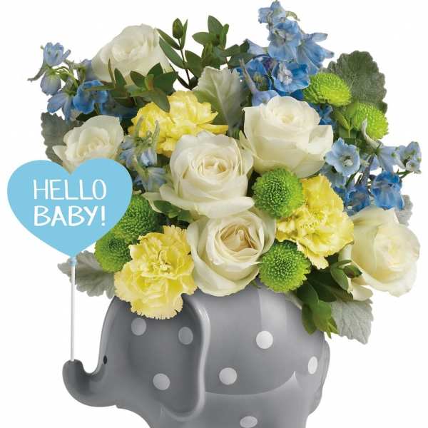 Bouquet in a gray polka-dot elephant container with a "Hello Baby!" sign