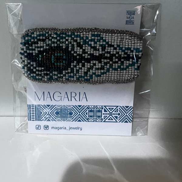 Beaded bracelet on a branded card in clear plastic packaging