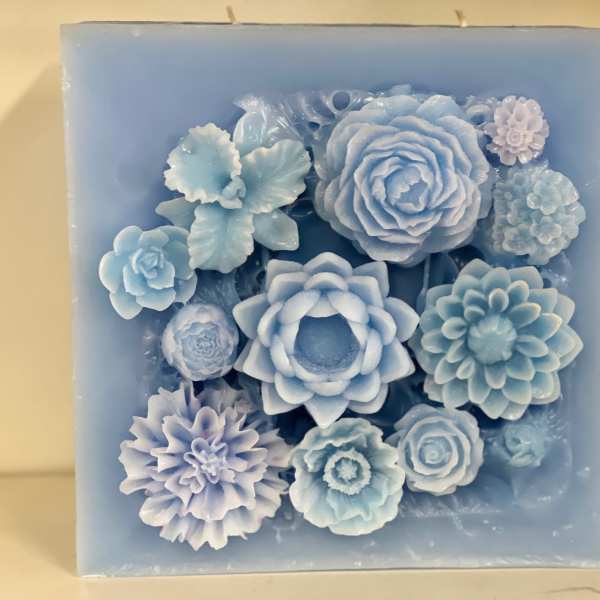 Blue floral candle with layered flower shapes