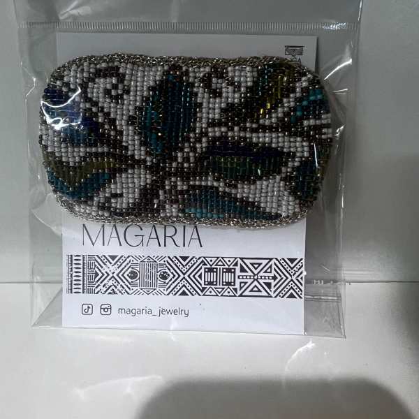 Beaded coin purse in a clear plastic package