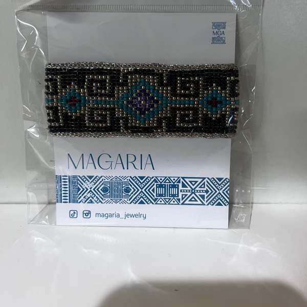 Beaded bracelet in a plastic package on a branded card