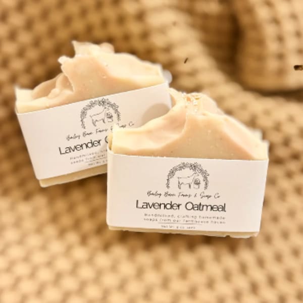 Two bars of lavender oatmeal soap with labels