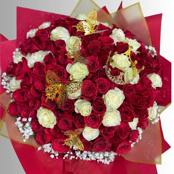 Bouquet of red and white roses with gold butterfly picks
