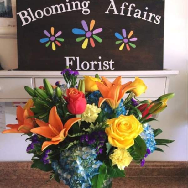 Colorful mixed bouquet in a clear glass vase