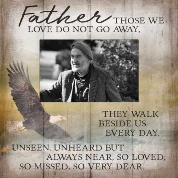 Memorial plaque with a man’s photo, eagle, and remembrance text