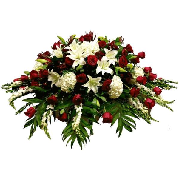 Large red and white floral spray with roses and lilies