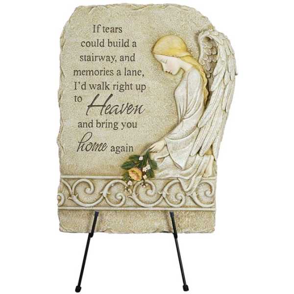 Memorial stone with an angel and sympathy message on a stand