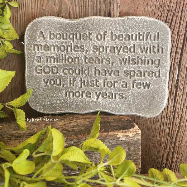Stone memorial plaque with an engraved sympathy message