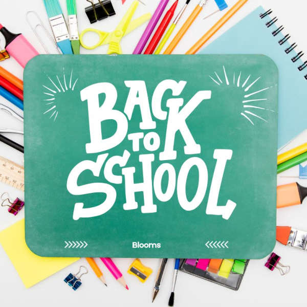 Back to school sign surrounded by colorful school supplies