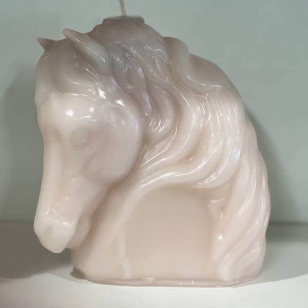 Glossy pale pink horse head figurine