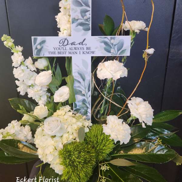 White floral cross with a memorial message for Dad