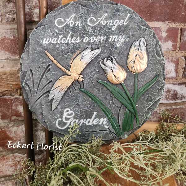 Round memorial plaque with a dragonfly and tulips, reading "An Angel watches over my Garden"