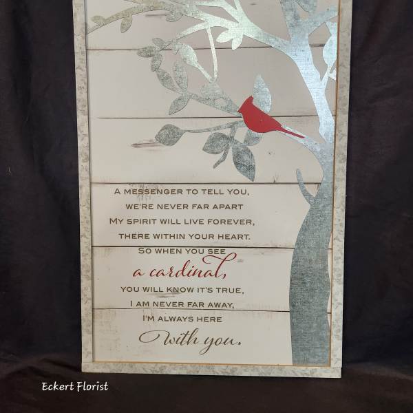 Framed memorial sign with a red cardinal on a tree branch and a sympathy poem