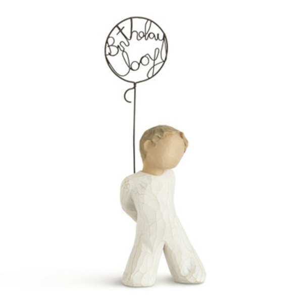 Small angel figurine holding a wire balloon that says "Birthday Boy"